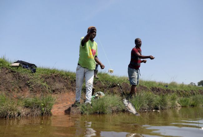 IN PICTURES | The dam a priest built serves as a lifeline for the community