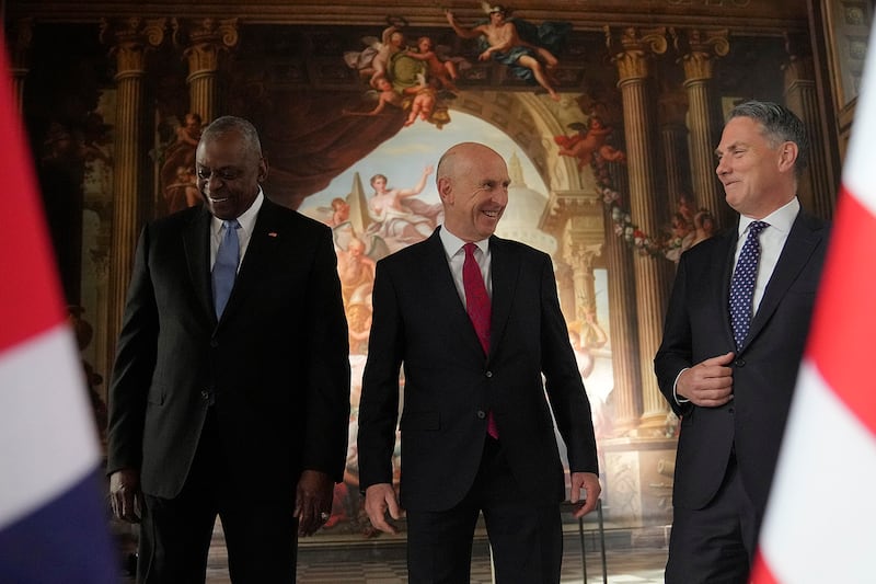 U.K. Defense Secretary John Healey, center, U.S. Secretary of Defense Lloyd Austin, left, and Australian Defense Minister Richard Marles are seen ahead of the AUKUS Defense Ministers Meeting in London, Sept. 26, 2024.