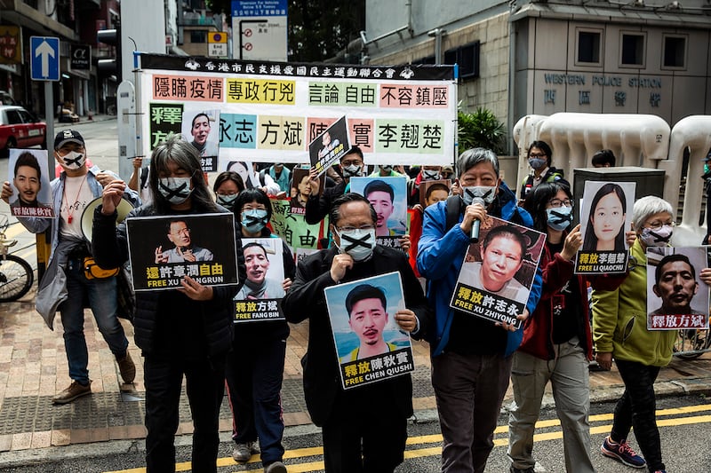 Demonstrators from the HK Alliance protest the detention of activist Xu Zhiyong, in Hong Kong on Feb. 19, 2020.