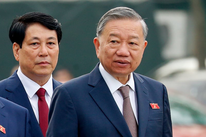 Vietnam's President Luong Cuong, left, and General Secretary of the Communist Party To Lam are seen outside the National Assembly in Hanoi on Oct. 21, 2024.