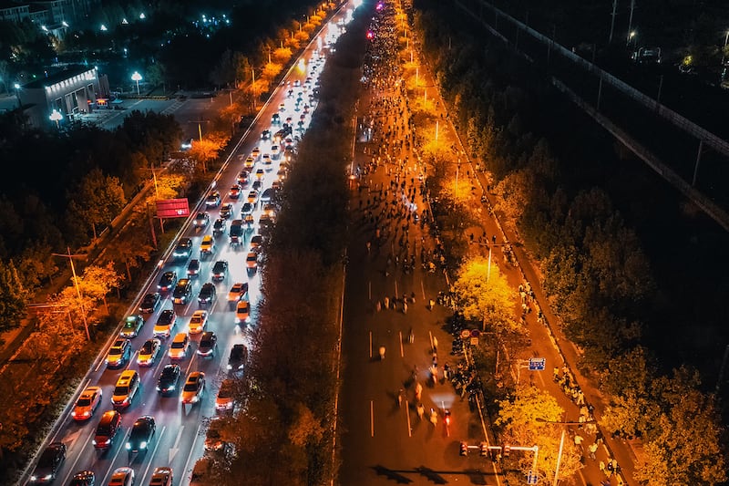 Thousands of college students ride bicycles on the Zhengkai Road in Zhengzhou, in China\'s Henan province, Nov. 9, 2024.