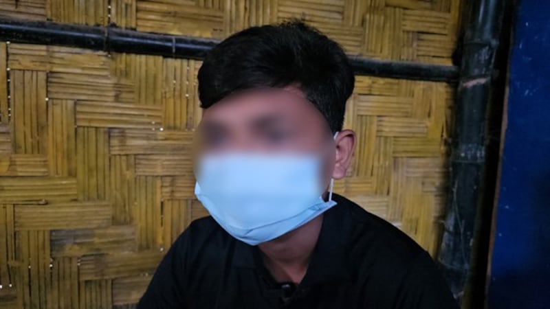 A 16-year-old Rohingya, whose face was blurred by BenarNews over safety concerns, is interviewed at a refugee camp in Cox’s Bazar, Bangladesh, after he was kidnapped and forced to fight in Myanmar’s civil war, Sept. 29, 2024.