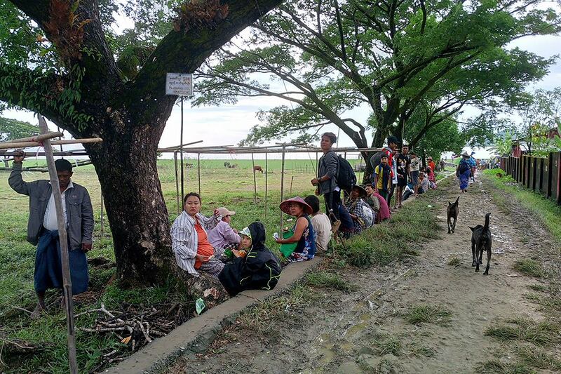 People flee from a village after fighting between Myanmar\'s military and the Arakan Army in Pauktaw township in western Rakhine state on Nov. 19, 2023.