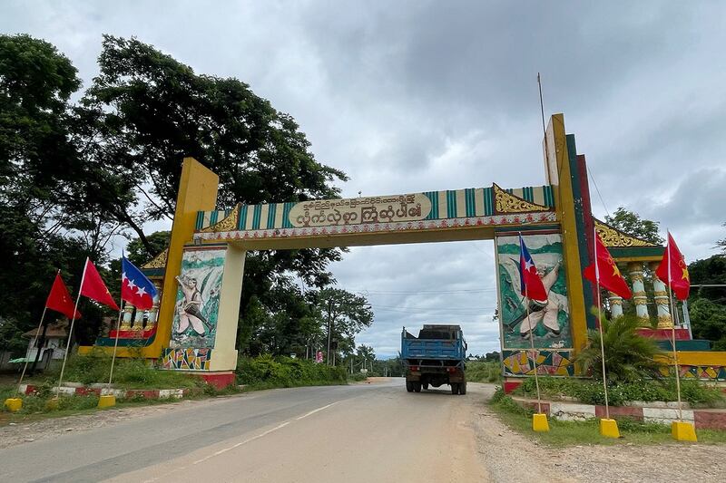 Myanmar National Democratic Alliance Army flags fly by the welcome archway to Lashio in Myanmar\'s northern Shan State, August 10, 2024.